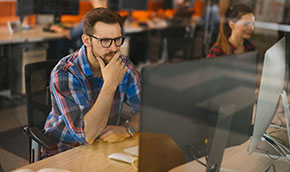 Man working on a computer in an office