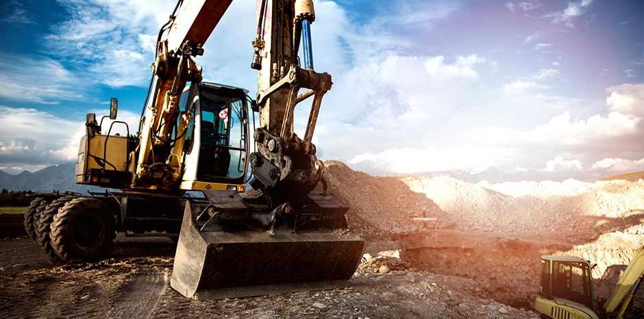 Two large civil engineering construction vehicles
