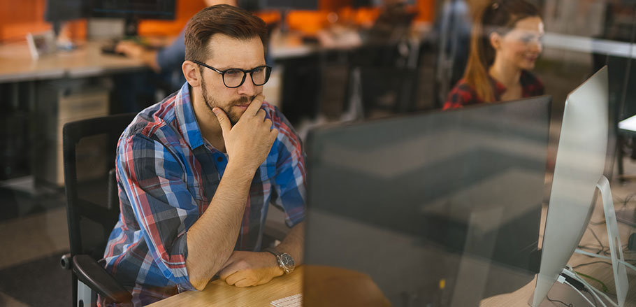 Man working on a computer in an office
